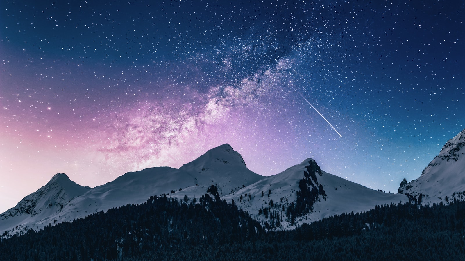 A lone mountain peak surrounded by a large expanse of empty sky.