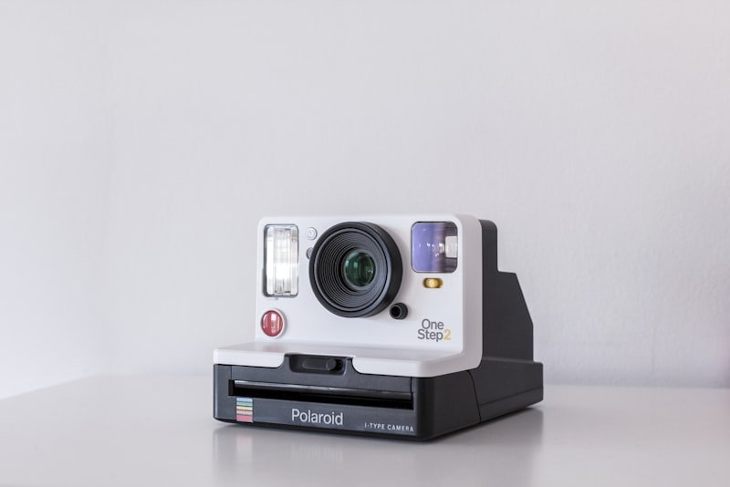Several used cameras arranged together on a shelf.